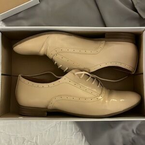 Nude patent leather oxfords